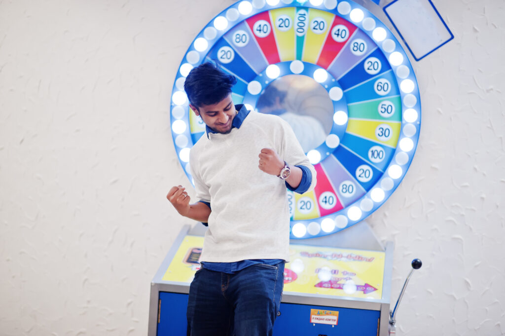 Branded Spin to Win game wheel with colorful prize sections, engaging customers at a marketing event.