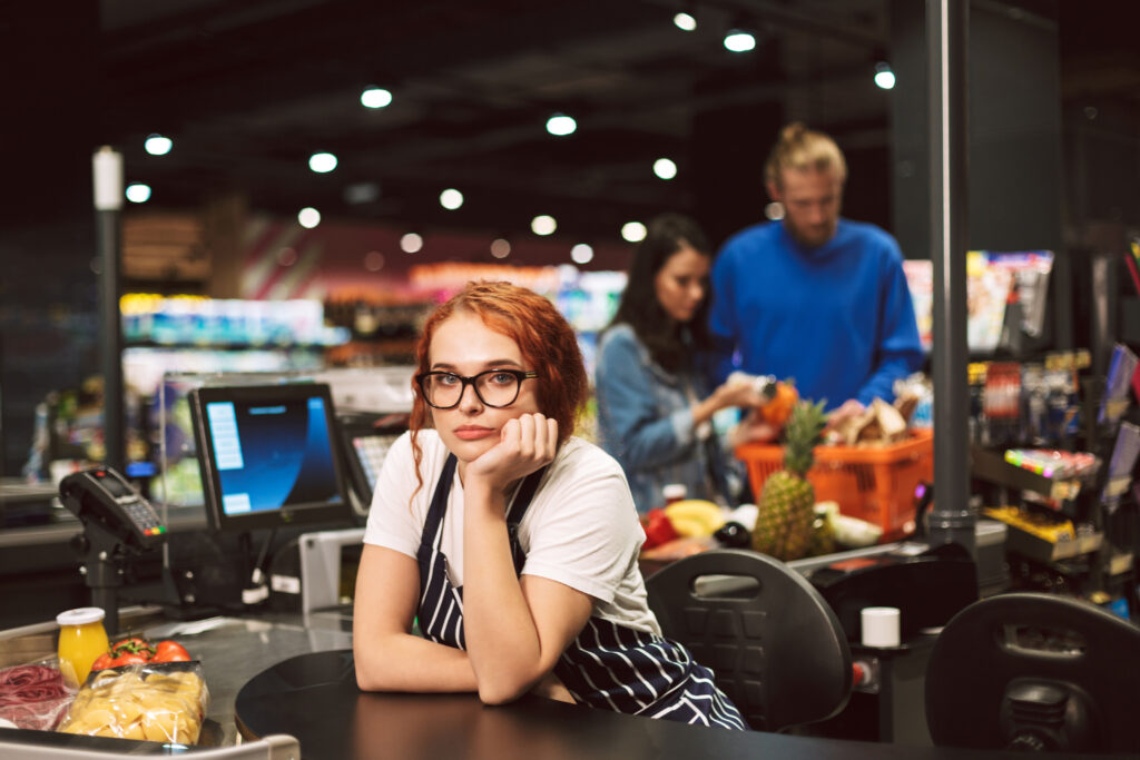 young boring cashier in eyeglasses and striped apr 2026 01 05 22 49 18 utc